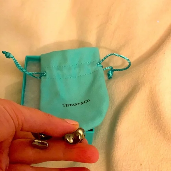 Authentic brand new Tiffany cufflinks with pouch.Rare and limited edition. Must!